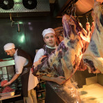 Donal lifting a side of beef ready for hanging